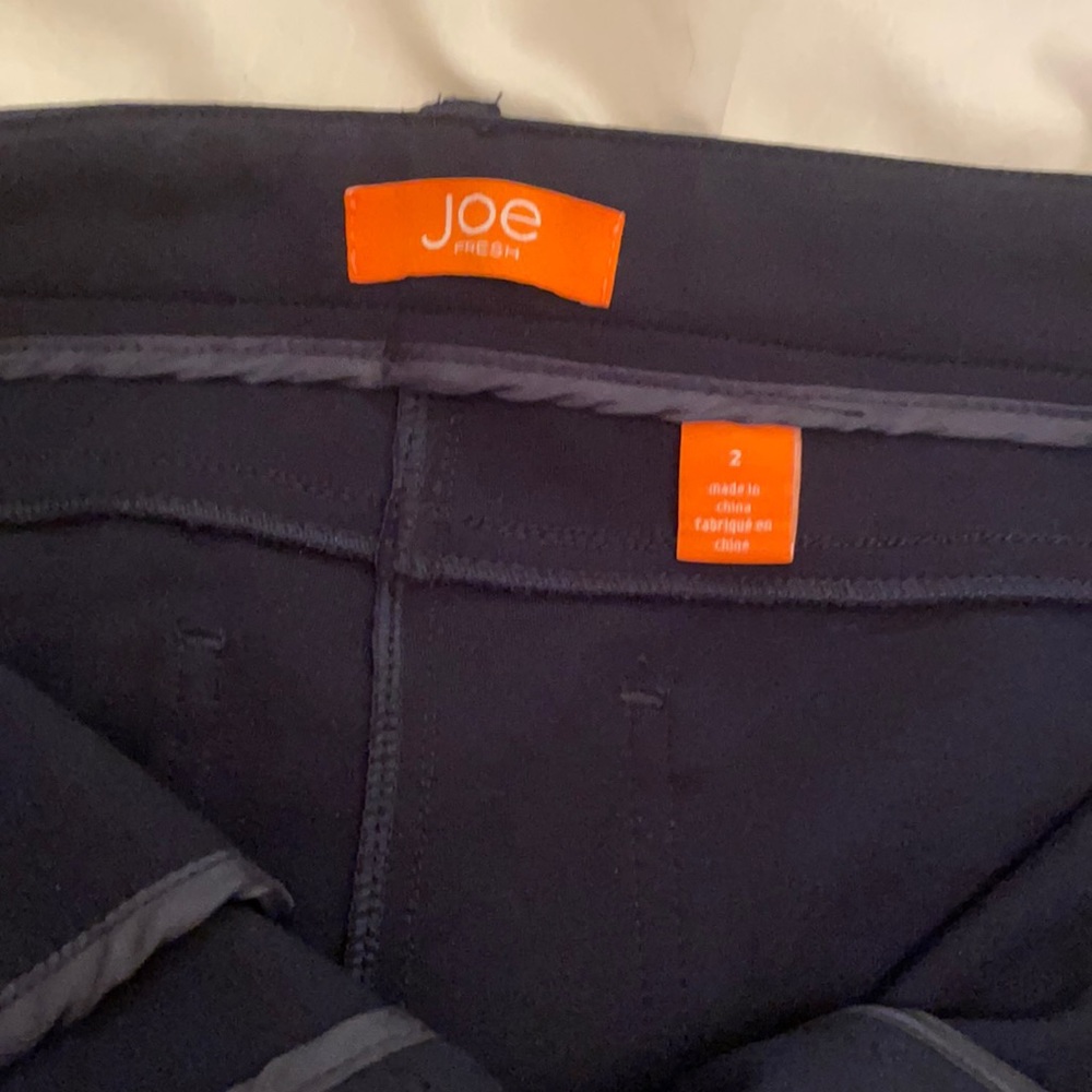 Dark navy blue stretch Joe pants. Never worn